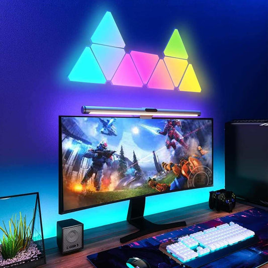Colorful 10-pack modular triangle smart wall light panels mounted above a computer monitor with customizable RGB lighting effects for gaming ambiance